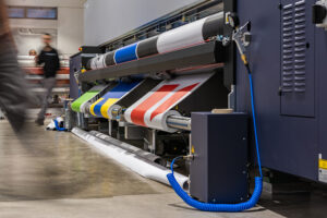 Very big printer during color sample phase, massive vinyl rolls,